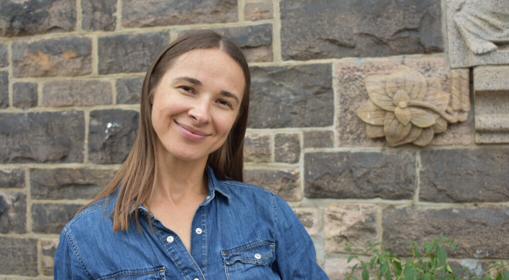 olga stands in front of the eliaskirke in copenhagen